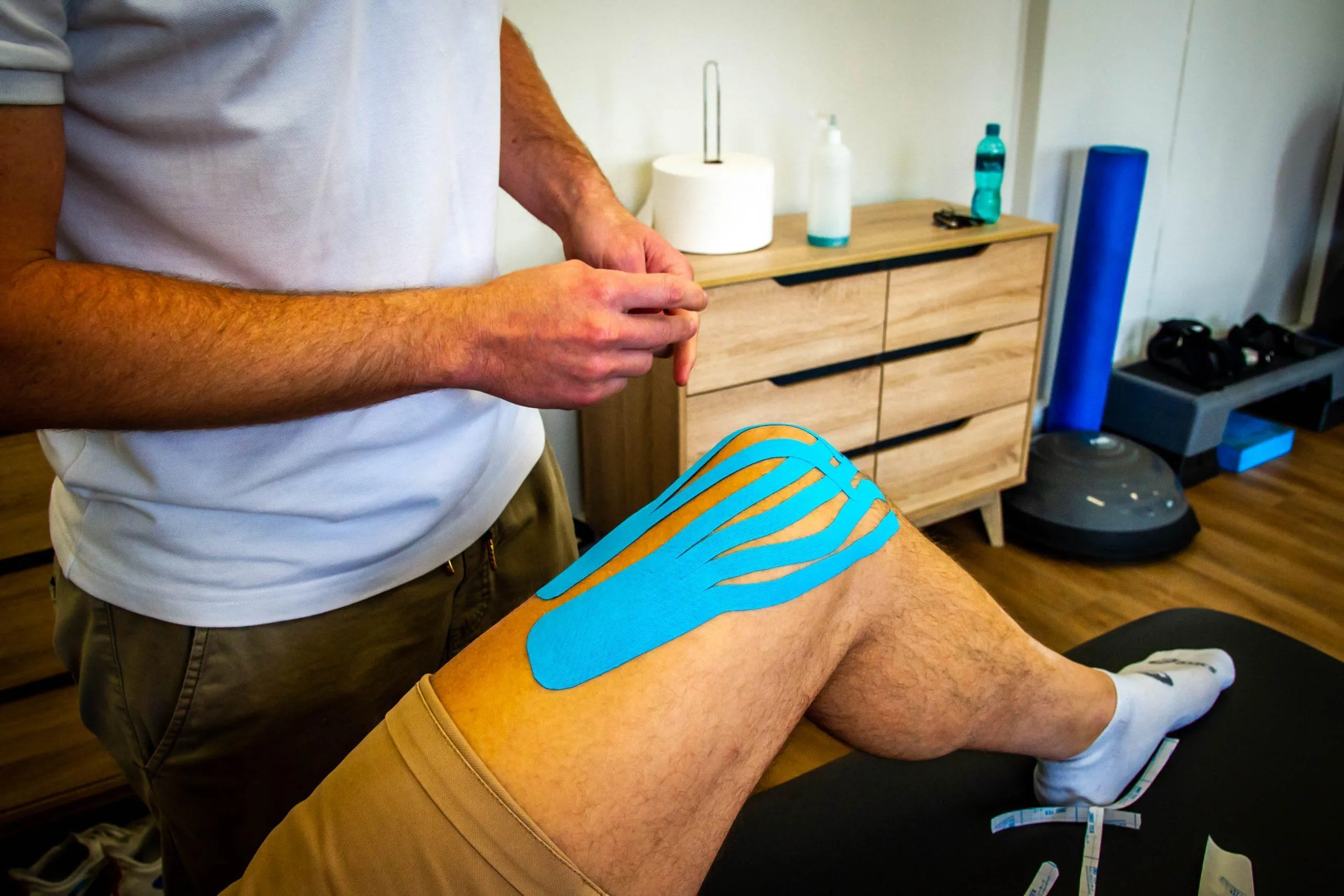Strapping and taping technique being applied